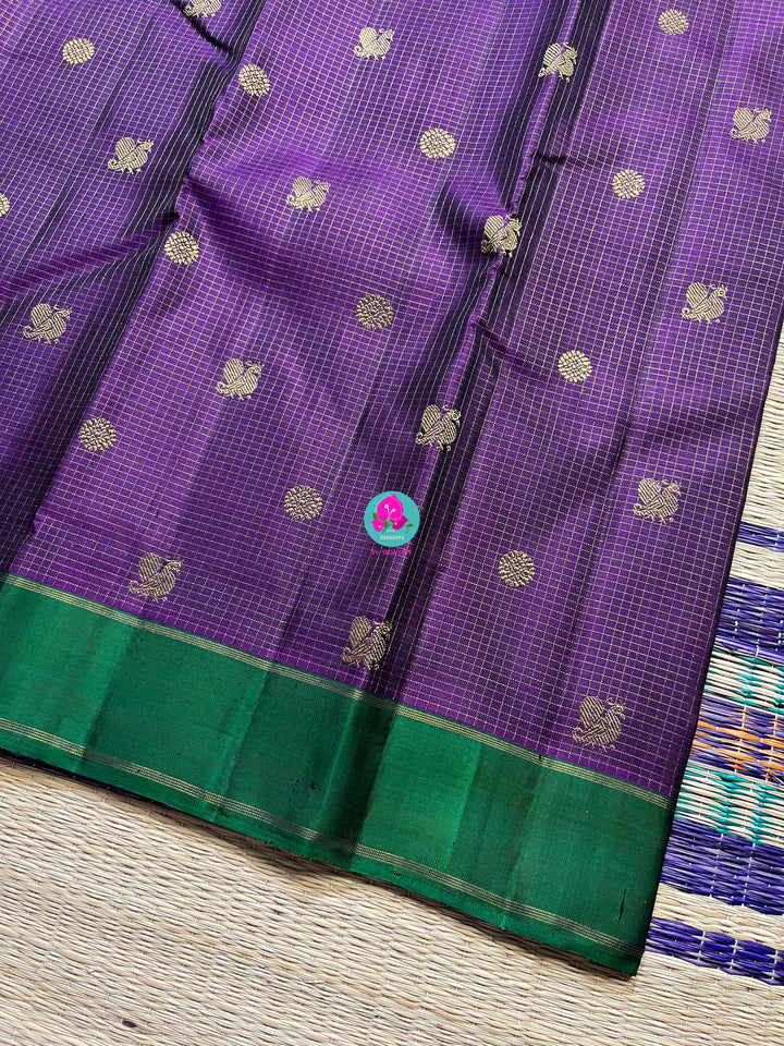 Pure zari purple saree with green constrast gap border