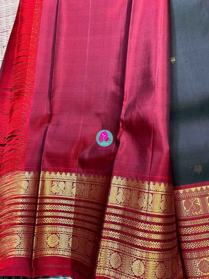 Pure Kanchipattu saree with Lotus Motifs in deep bottle green
