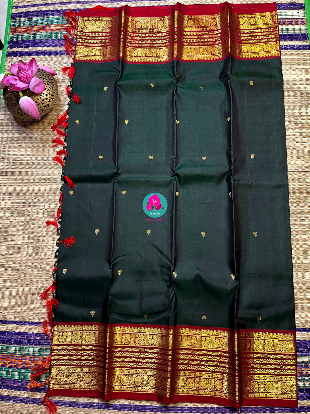 Pure Kanchipattu saree with Lotus Motifs in deep bottle green