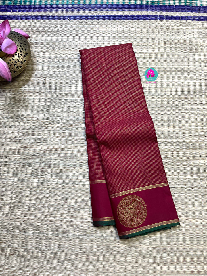 Maroon Kanchipuram handloom saree with 2g zari border butta body vaira oosi checks.