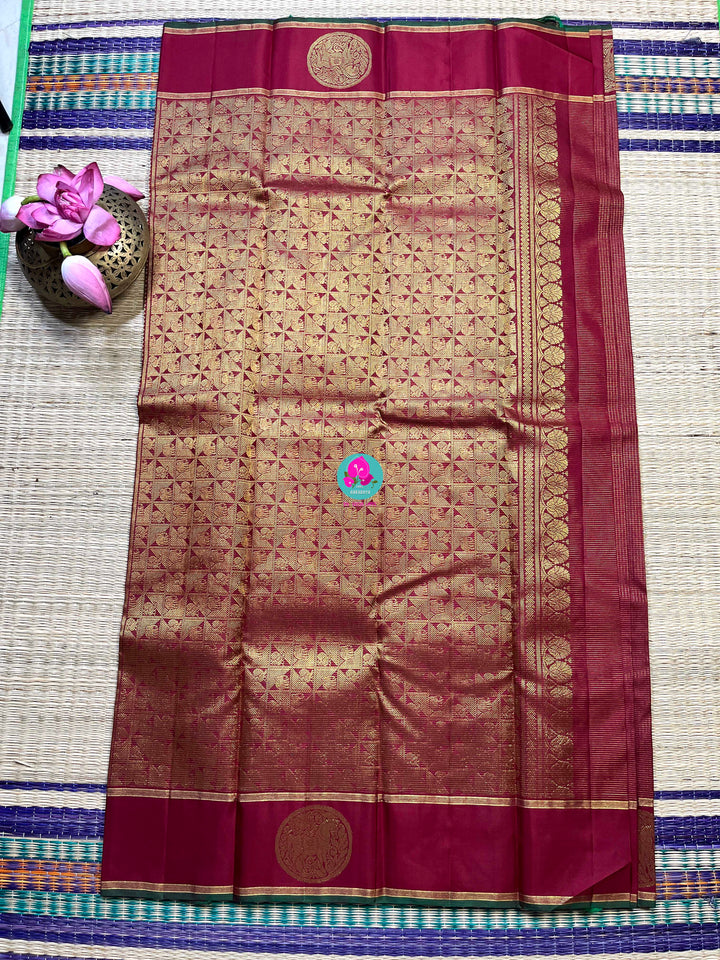 Maroon Kanchipuram handloom saree with 2g zari border butta body vaira oosi checks.