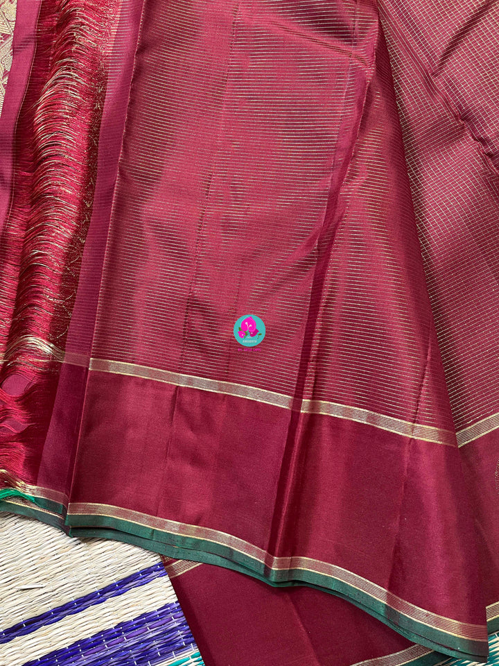 Maroon Kanchipuram handloom saree with 2g zari border butta body vaira oosi checks.
