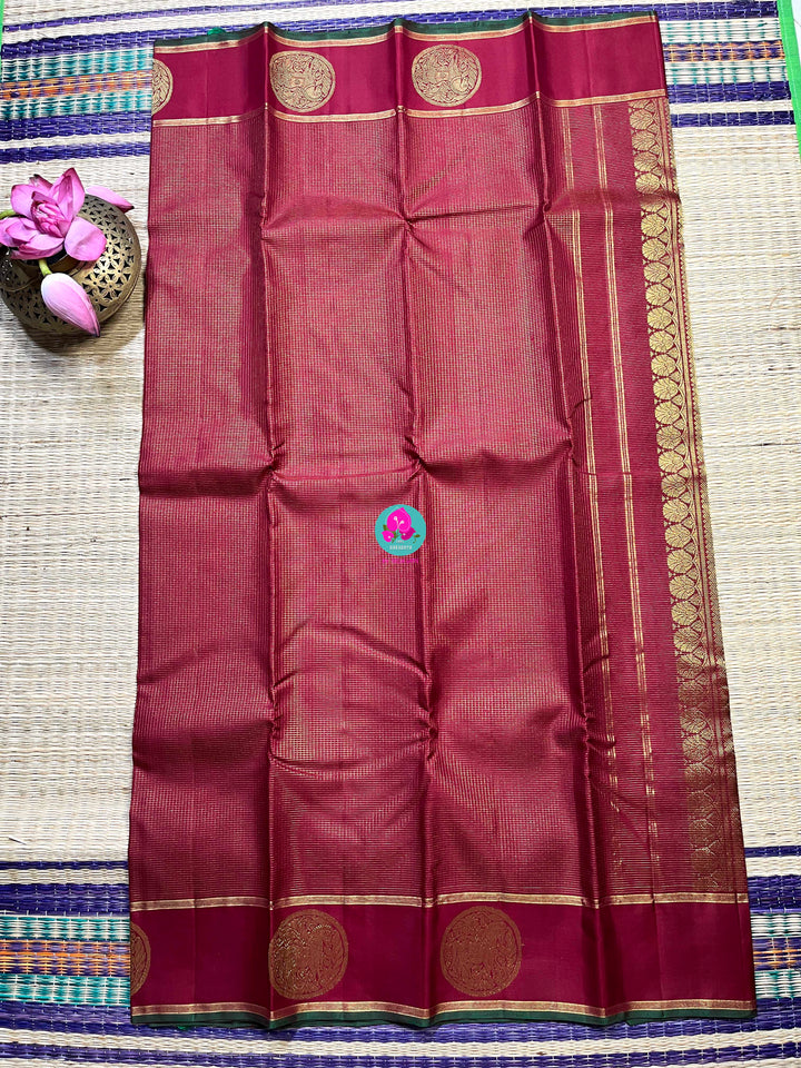 Maroon Kanchipuram handloom saree with 2g zari border butta body vaira oosi checks.