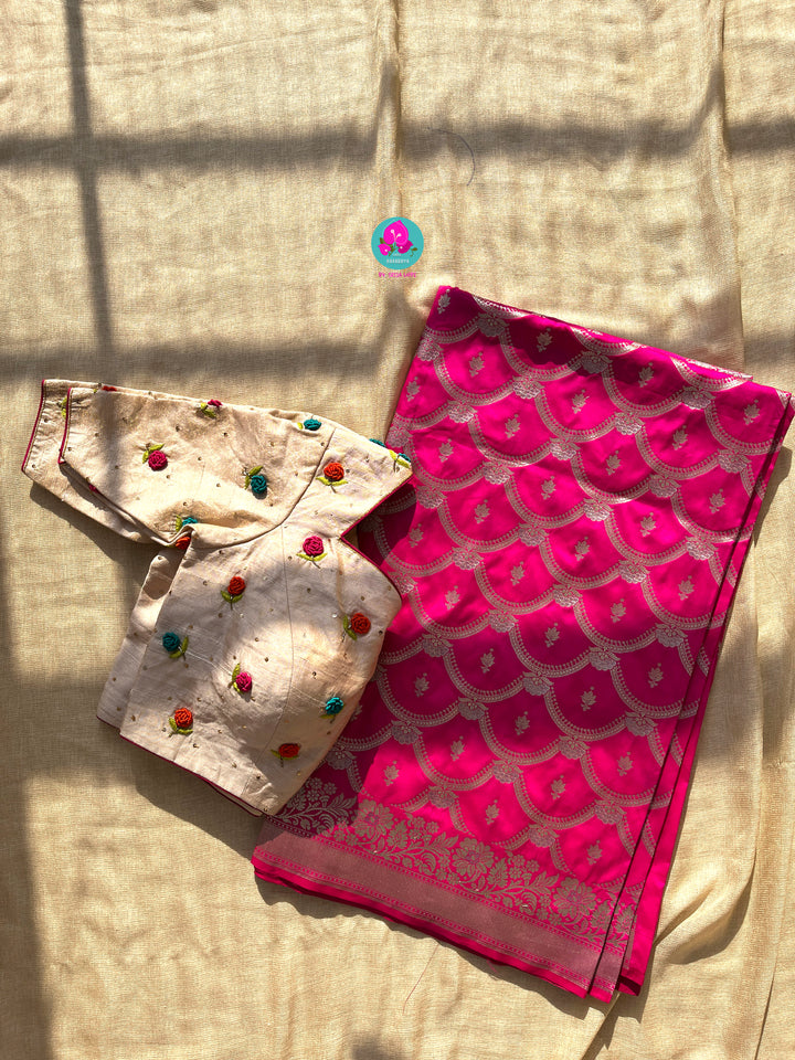 Semi Banarasi Silk Saree paired with pure tissue rawsilk blouse embroidered with rose knot