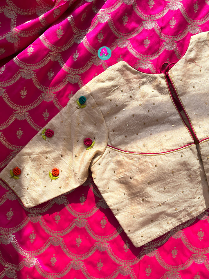 Semi Banarasi Silk Saree paired with pure tissue rawsilk blouse embroidered with rose knot