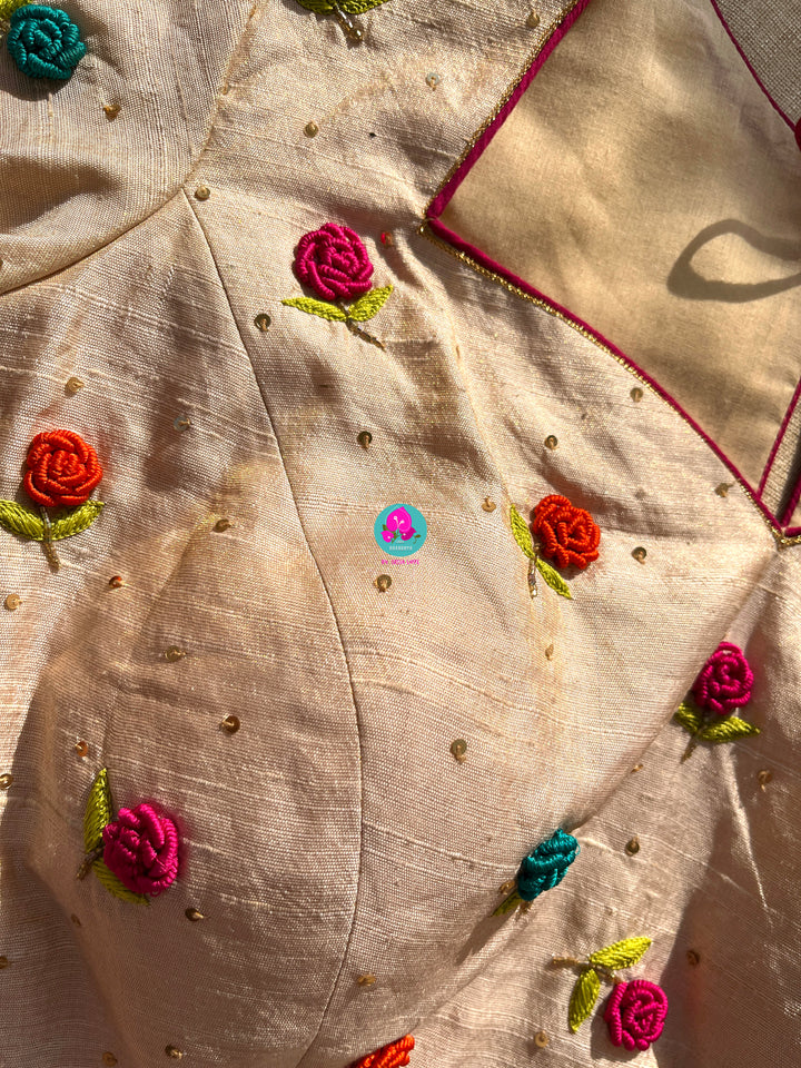 Semi Banarasi Silk Saree paired with pure tissue rawsilk blouse embroidered with rose knot