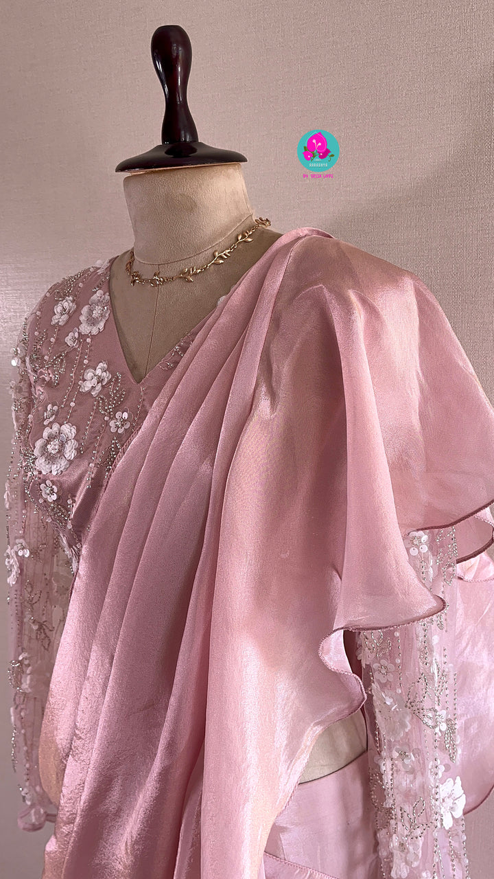 Peach tissue georgette ruffle saree with heavy embroidery net blouse
