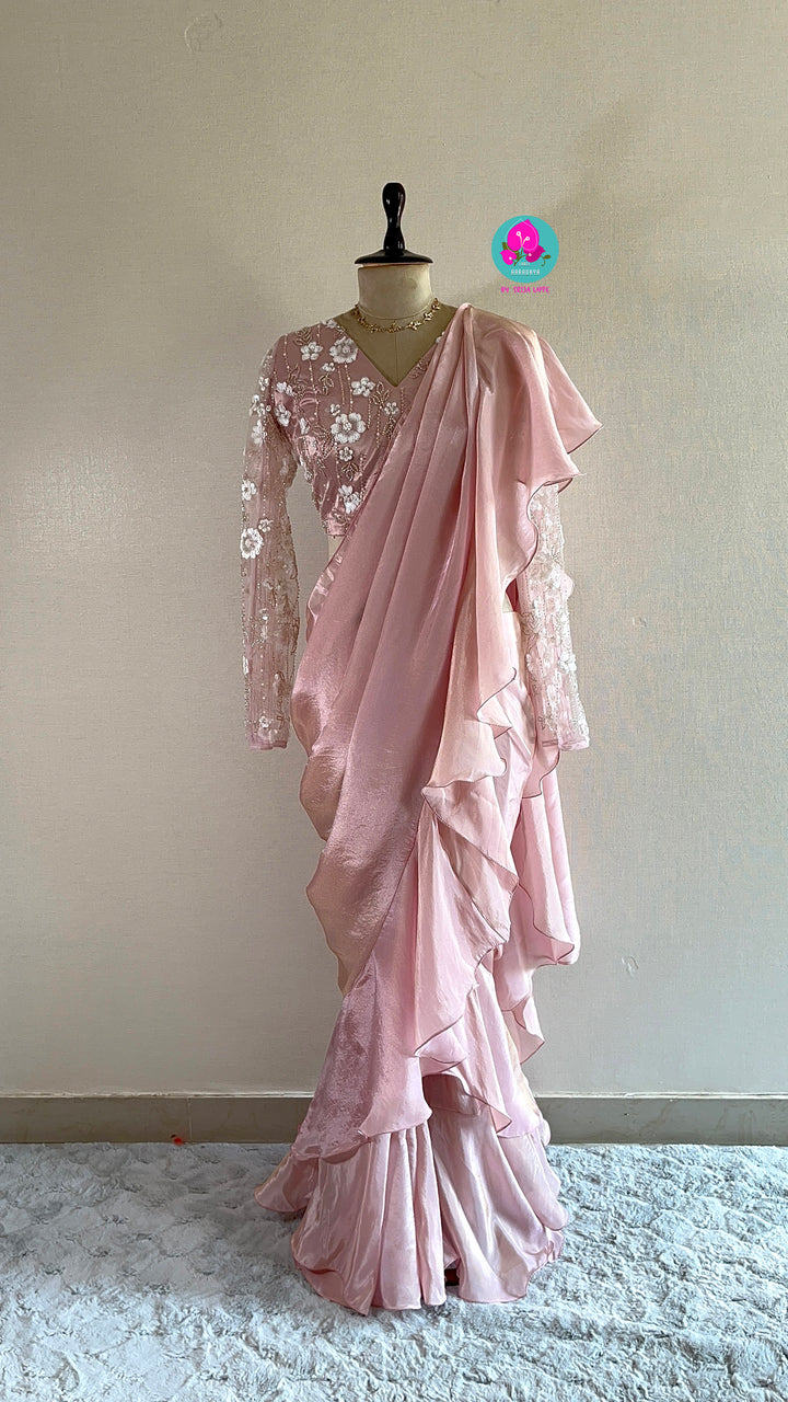 Peach tissue georgette ruffle saree with heavy embroidery net blouse