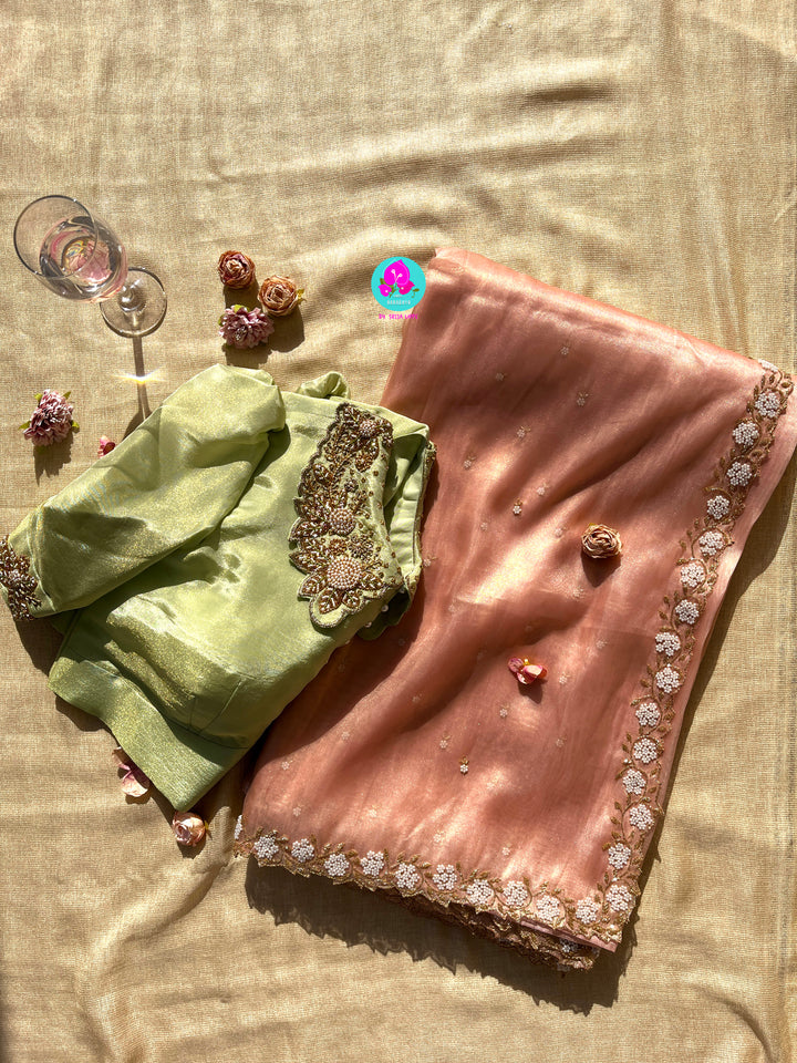 We call it a cocktail soft tissue silk saree with a flowy drape, paired with a Peter Pan collar blouse in matching tissue.