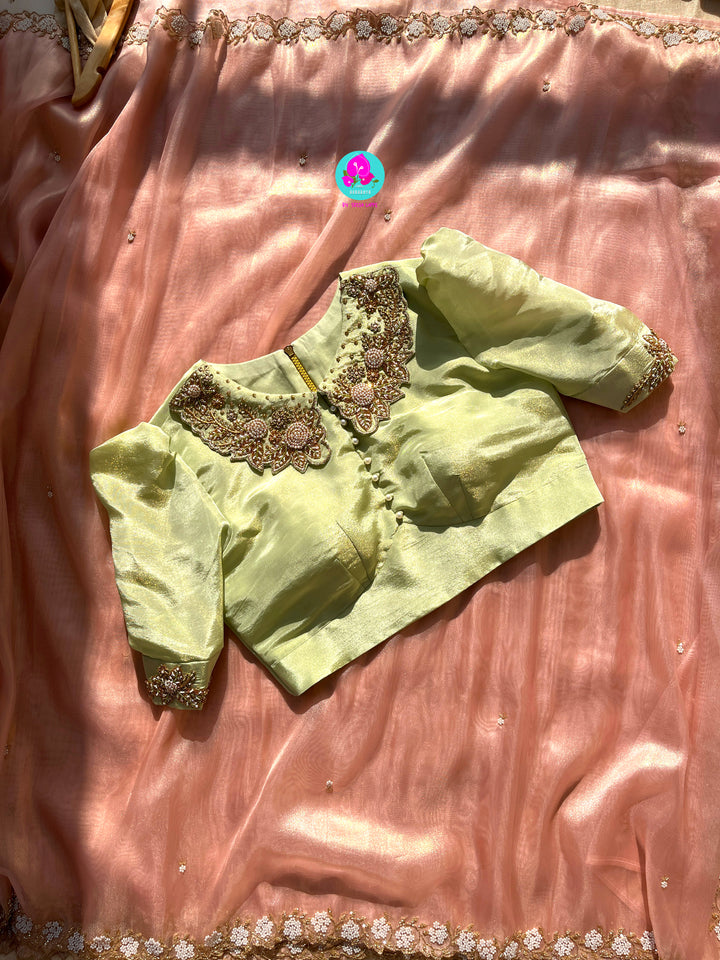 We call it a cocktail soft tissue silk saree with a flowy drape, paired with a Peter Pan collar blouse in matching tissue.