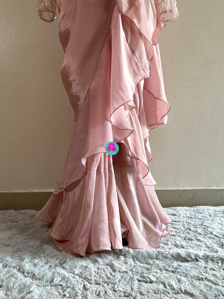 Peach tissue georgette ruffle saree with heavy embroidery net blouse