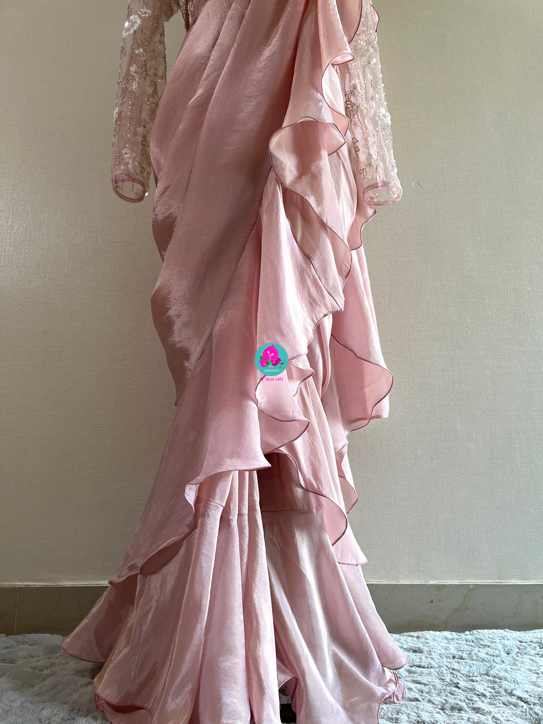 Peach tissue georgette ruffle saree with heavy embroidery net blouse