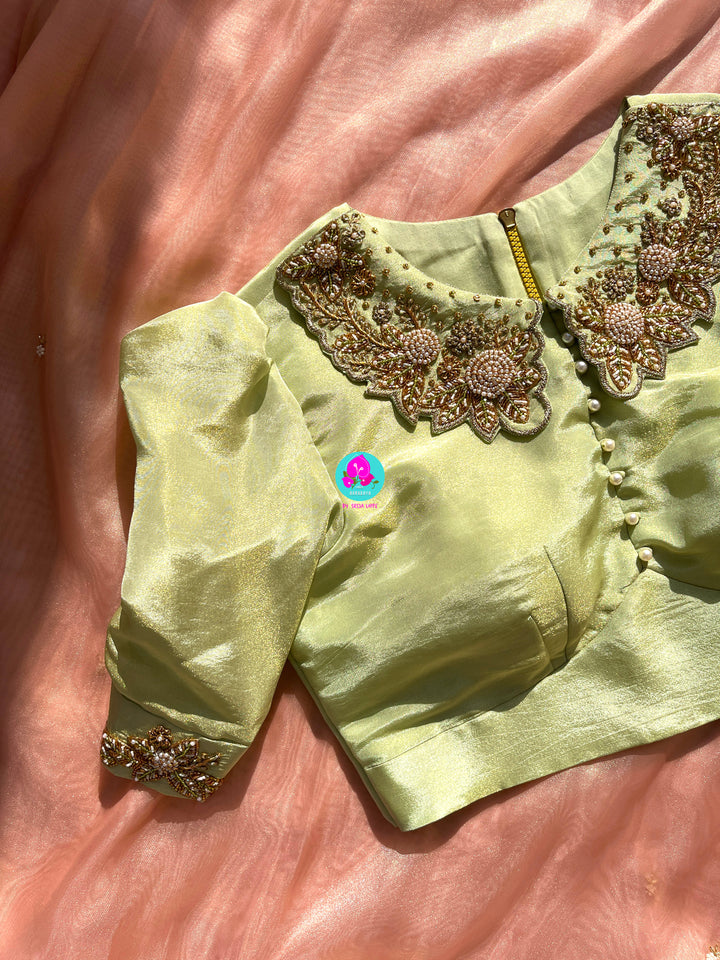 We call it a cocktail soft tissue silk saree with a flowy drape, paired with a Peter Pan collar blouse in matching tissue.