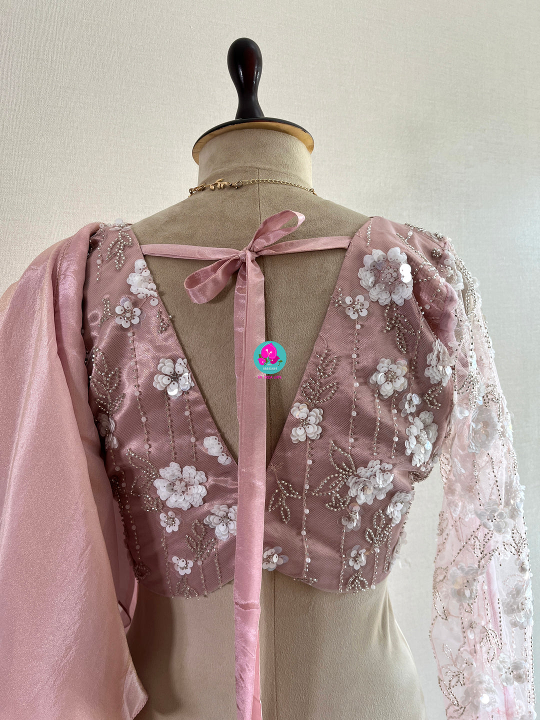 Peach tissue georgette ruffle saree with heavy embroidery net blouse