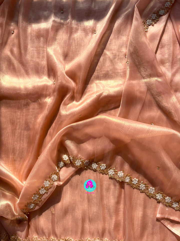 We call it a cocktail soft tissue silk saree with a flowy drape, paired with a Peter Pan collar blouse in matching tissue.