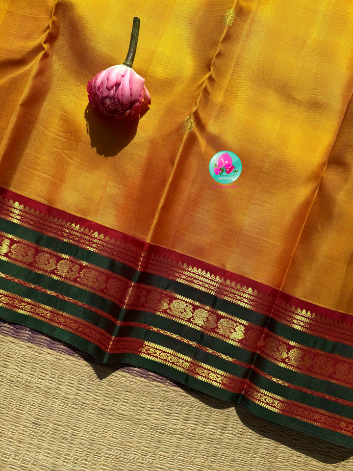 Gilded Sunshine: The Mustard Yellow Kanjeevaram & Emerald Tanjore Masterpiece