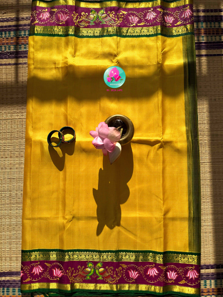Solar Radiance: The Midday Yellow & Hand-Painted Tanjore Kanchipattu Saree