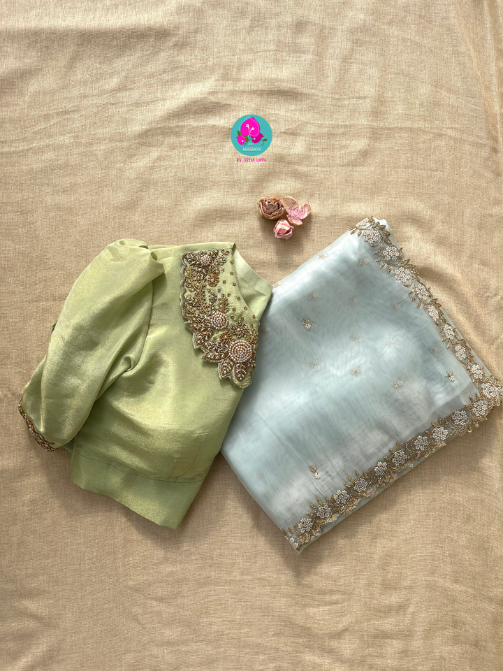 We call it a cocktail soft tissue silk saree with a flowy drape, paired with a Peter Pan collar blouse in matching tissue