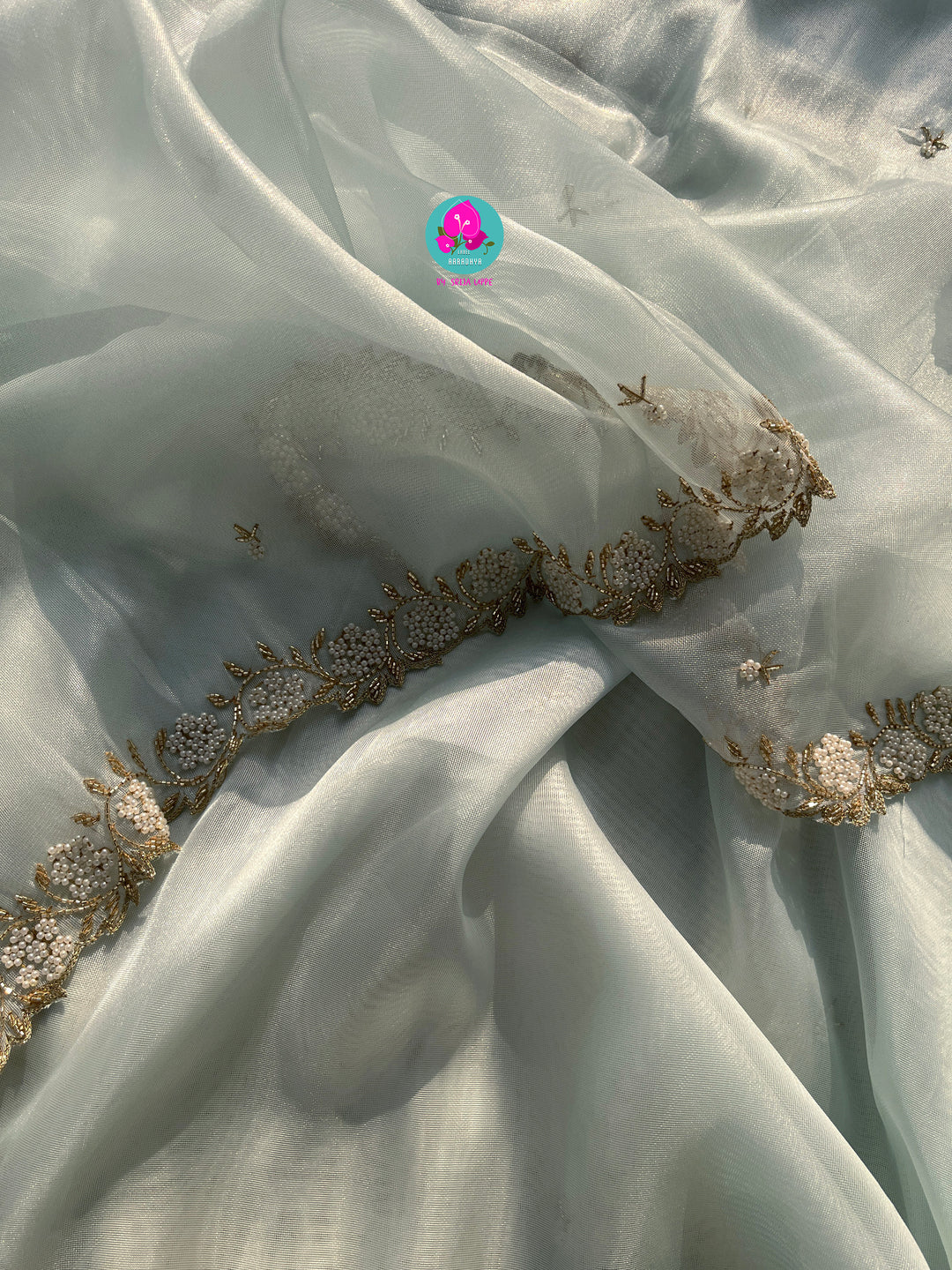 We call it a cocktail soft tissue silk saree with a flowy drape, paired with a Peter Pan collar blouse in matching tissue