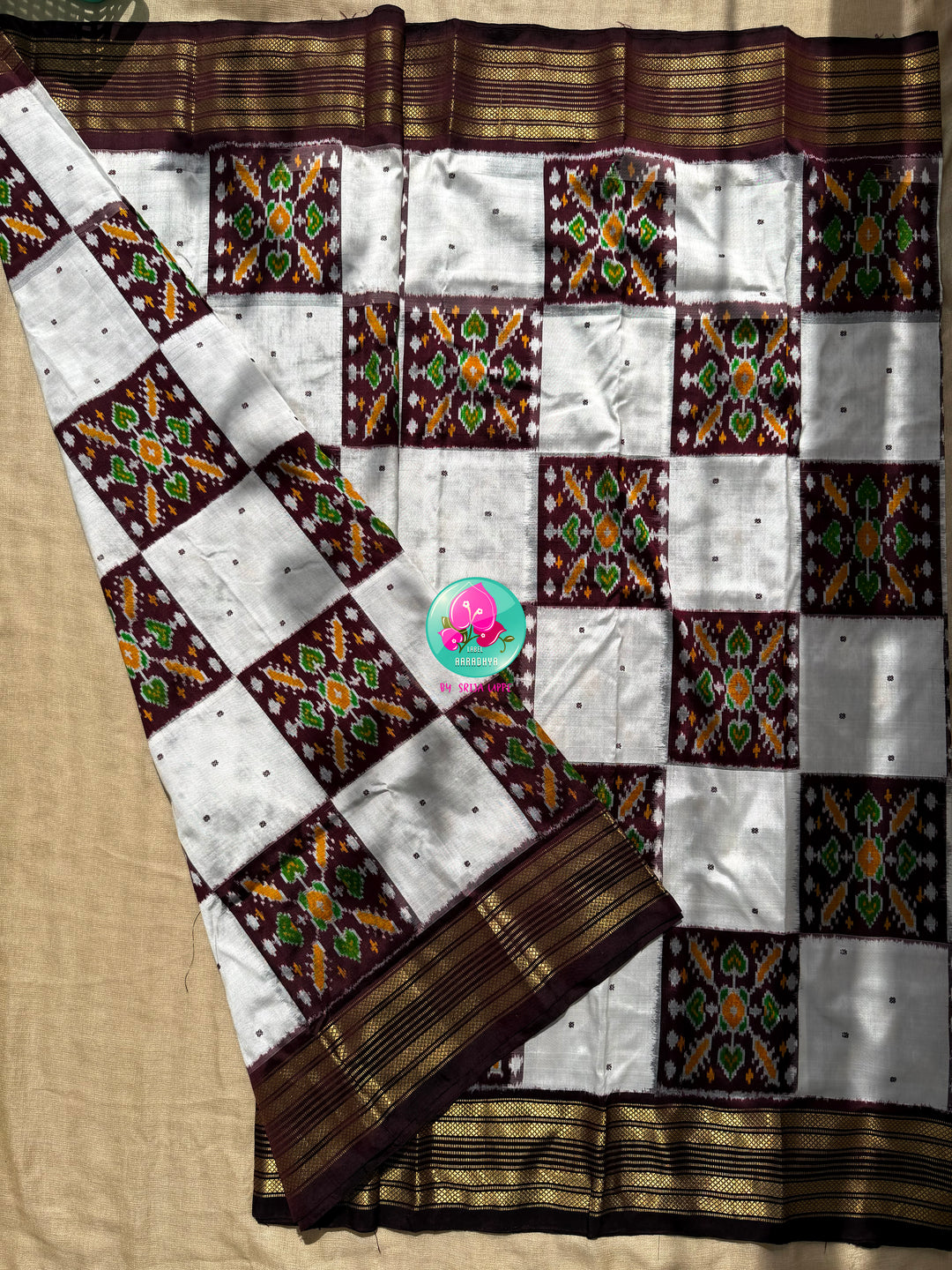Rhythmic Geometry: The Earthy Brown & Crisp White Pure Silk Ikkat Masterpiece