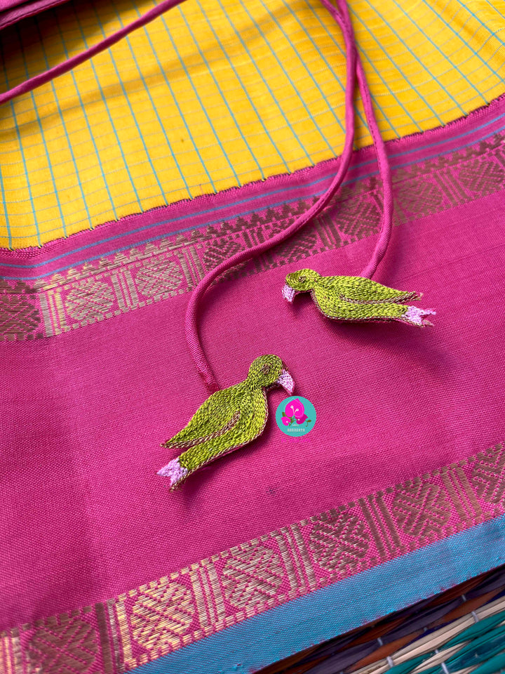 Pure zari Kanchipattu saree in Madras checks and Ganga Jamuna border paired with Hand Embroidered blouse