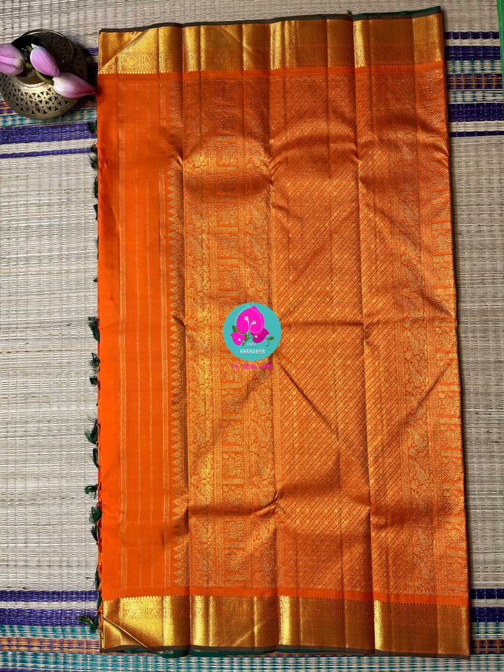 Beautiful orange color pure Kanchipattu saree with Belldari Checkered butta