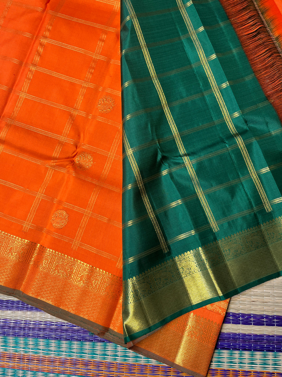 Beautiful orange color pure Kanchipattu saree with Belldari Checkered butta