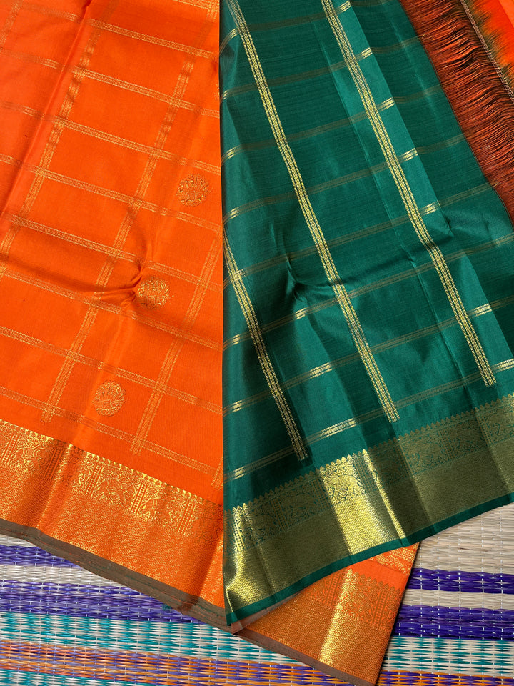 Beautiful orange color pure Kanchipattu saree with Belldari Checkered butta