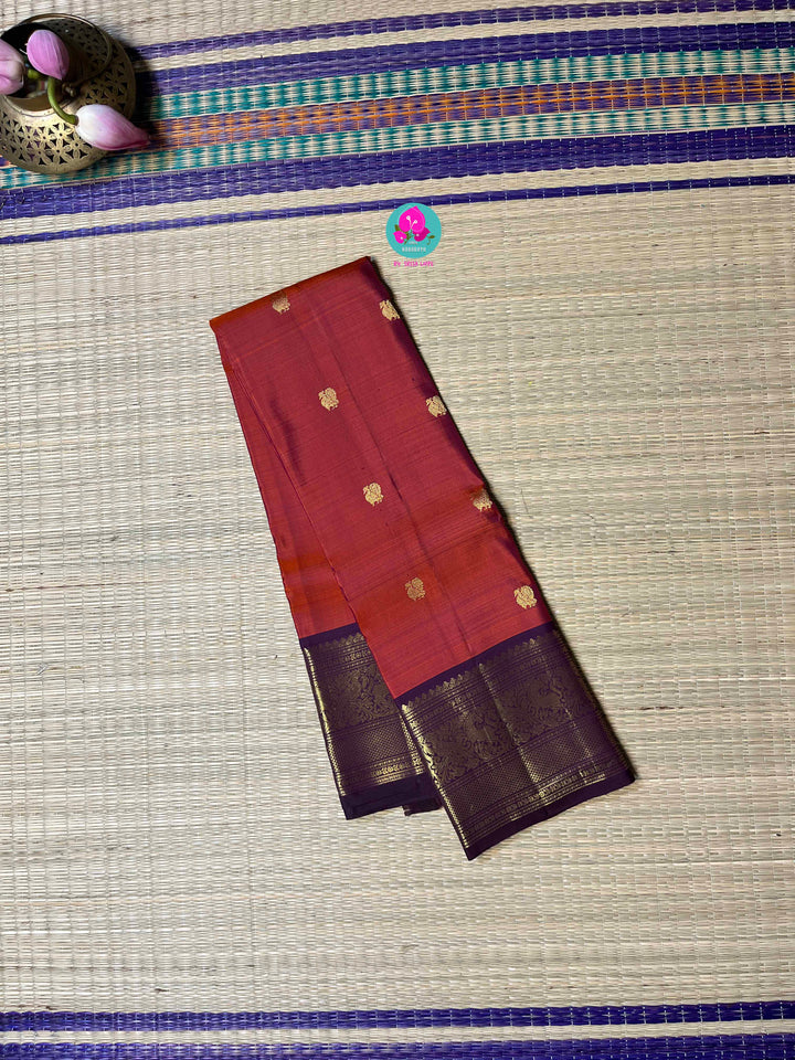 2g Zari Kanchipattu saree in rustic red maroon and dark purple.