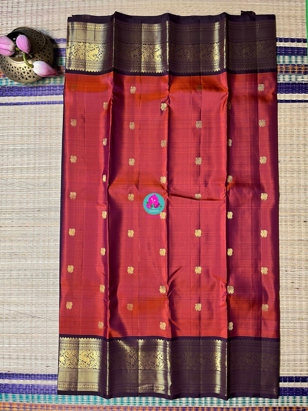 2g Zari Kanchipattu saree in rustic red maroon and dark purple.