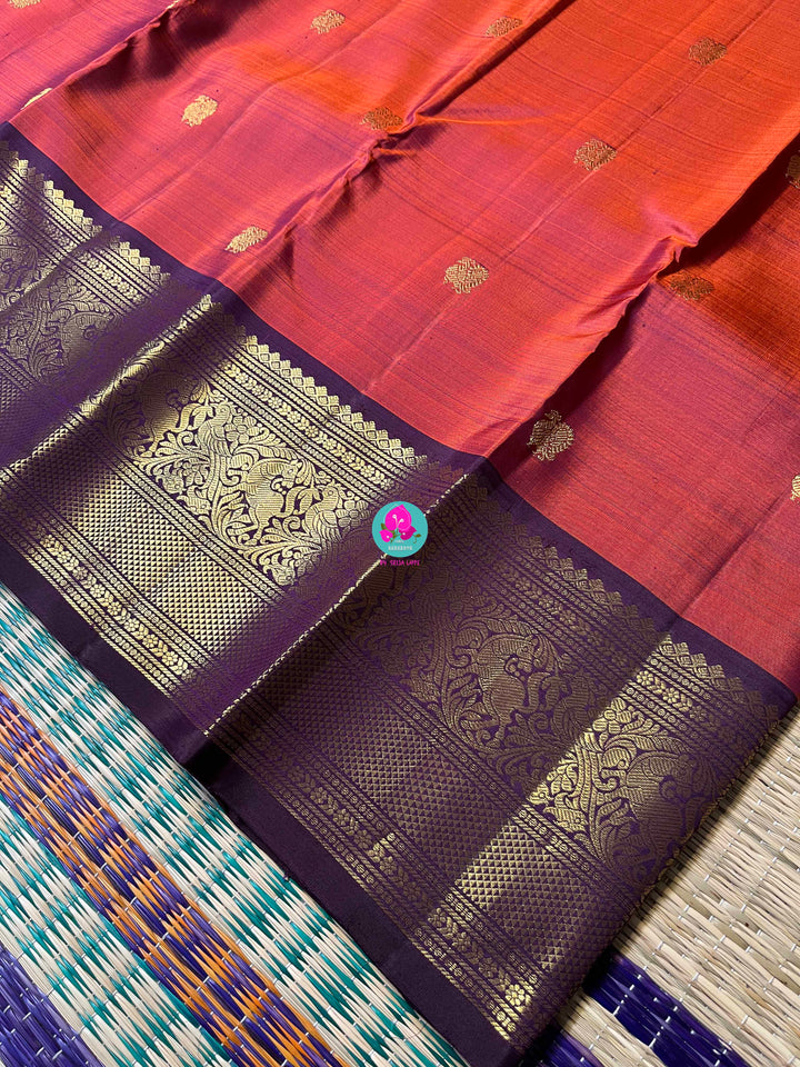 2g Zari Kanchipattu saree in rustic red maroon and dark purple.