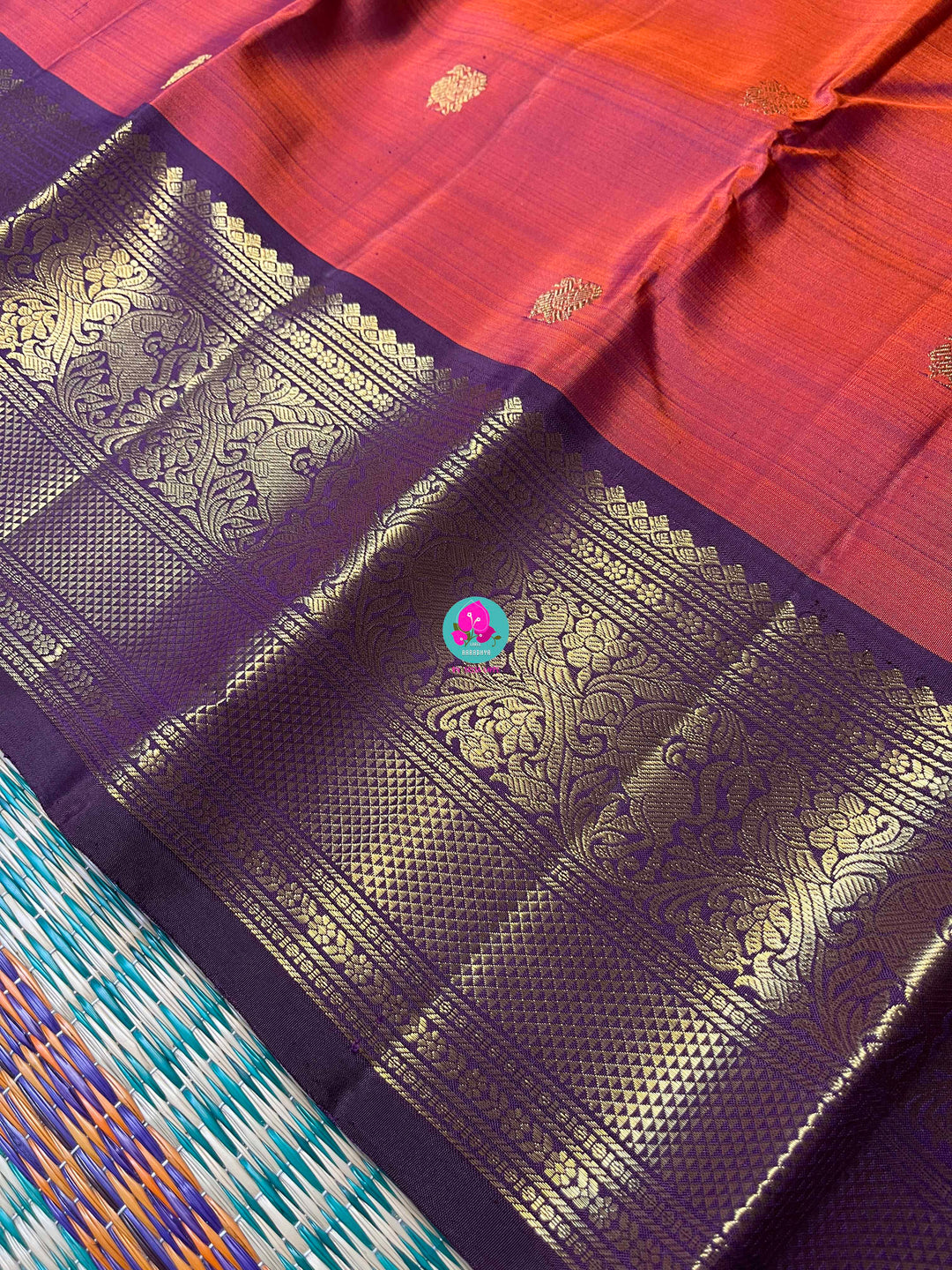 2g Zari Kanchipattu saree in rustic red maroon and dark purple.