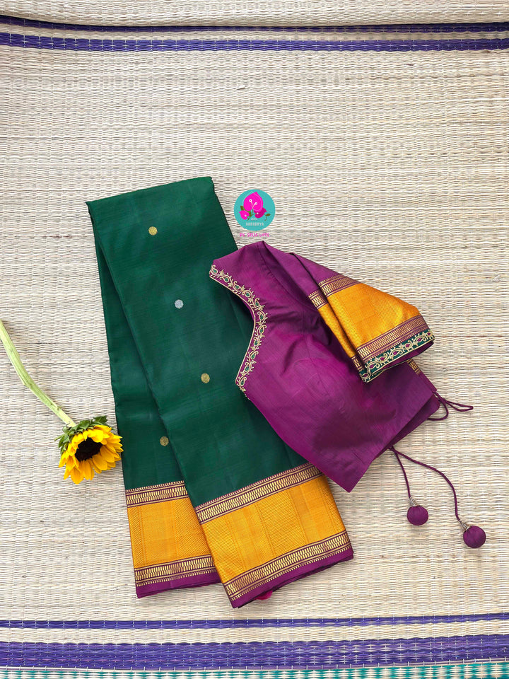 Pure Kanchipattu treasure Bottle green saree with hand embroidered purplish pink blouse