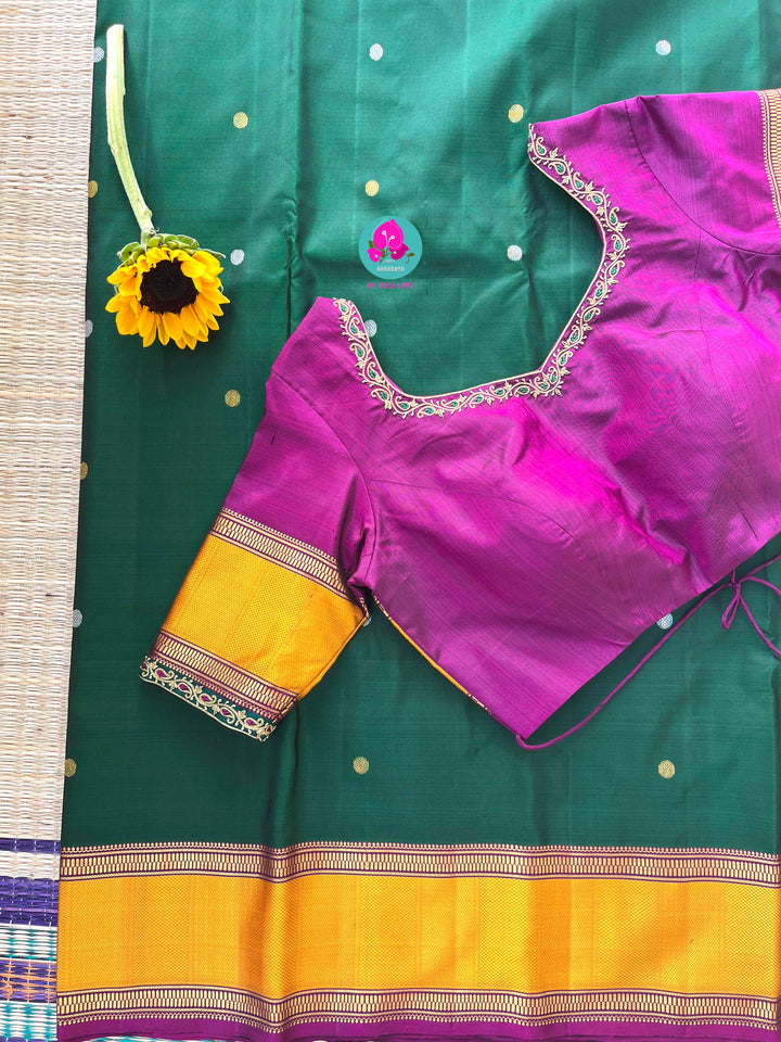 Pure Kanchipattu treasure Bottle green saree with hand embroidered purplish pink blouse