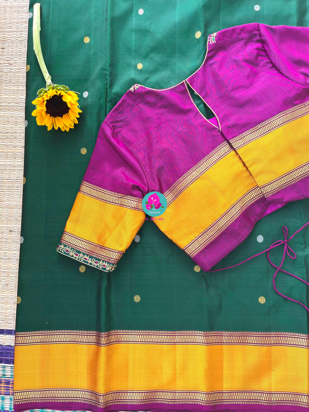 Pure Kanchipattu treasure Bottle green saree with hand embroidered purplish pink blouse