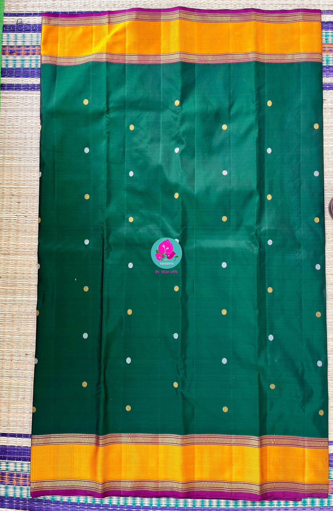 Pure Kanchipattu treasure Bottle green saree with hand embroidered purplish pink blouse