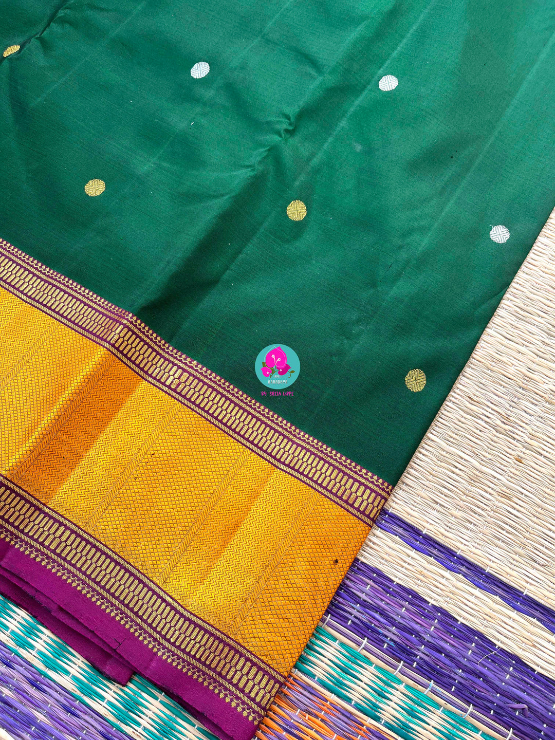 Pure Kanchipattu treasure Bottle green saree with hand embroidered purplish pink blouse