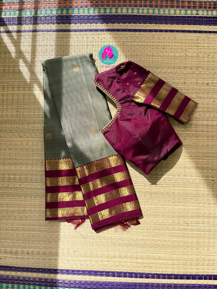 Pure Kanchipattu treasure in Elaichi greenish grey color paired with hand embroidered blouse