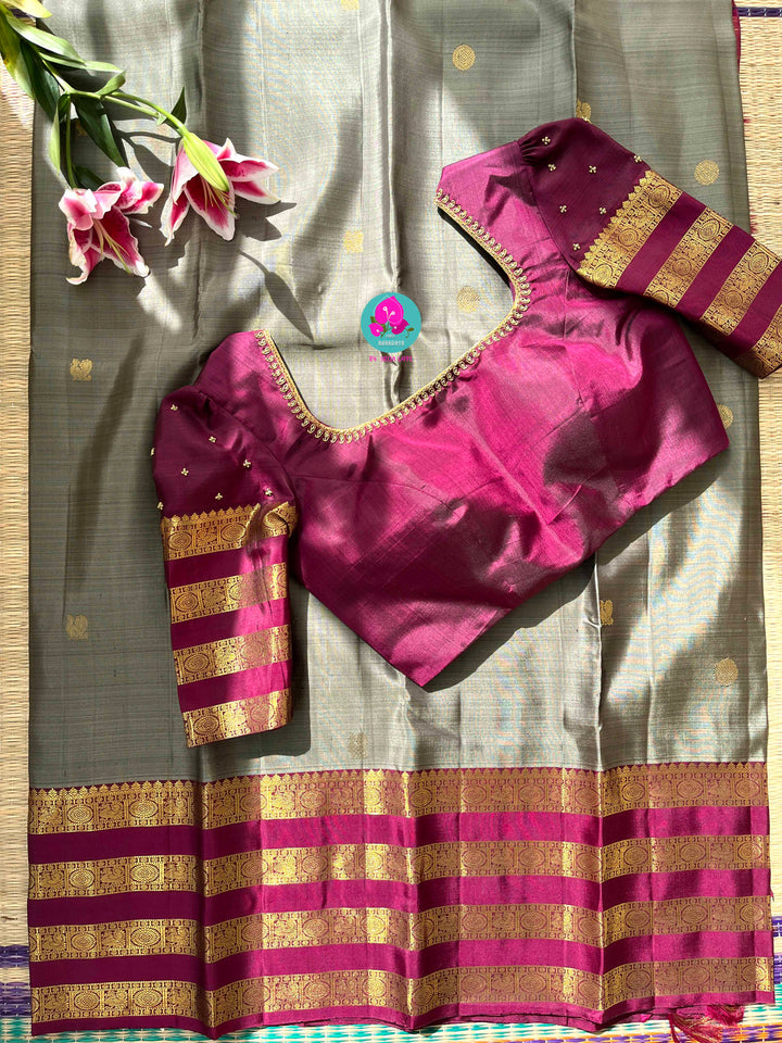 Pure Kanchipattu treasure in Elaichi greenish grey color paired with hand embroidered blouse