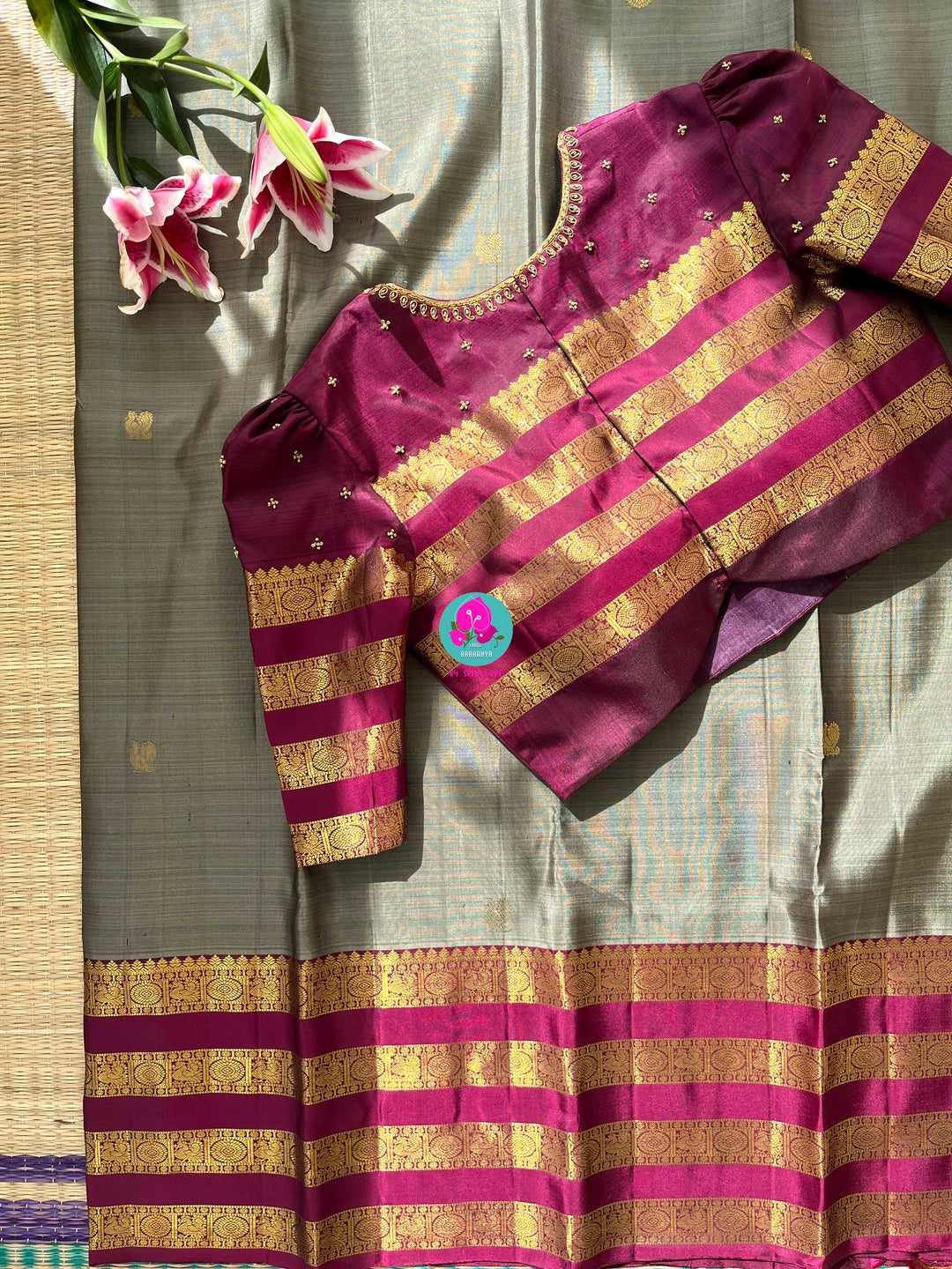 Pure Kanchipattu treasure in Elaichi greenish grey color paired with hand embroidered blouse