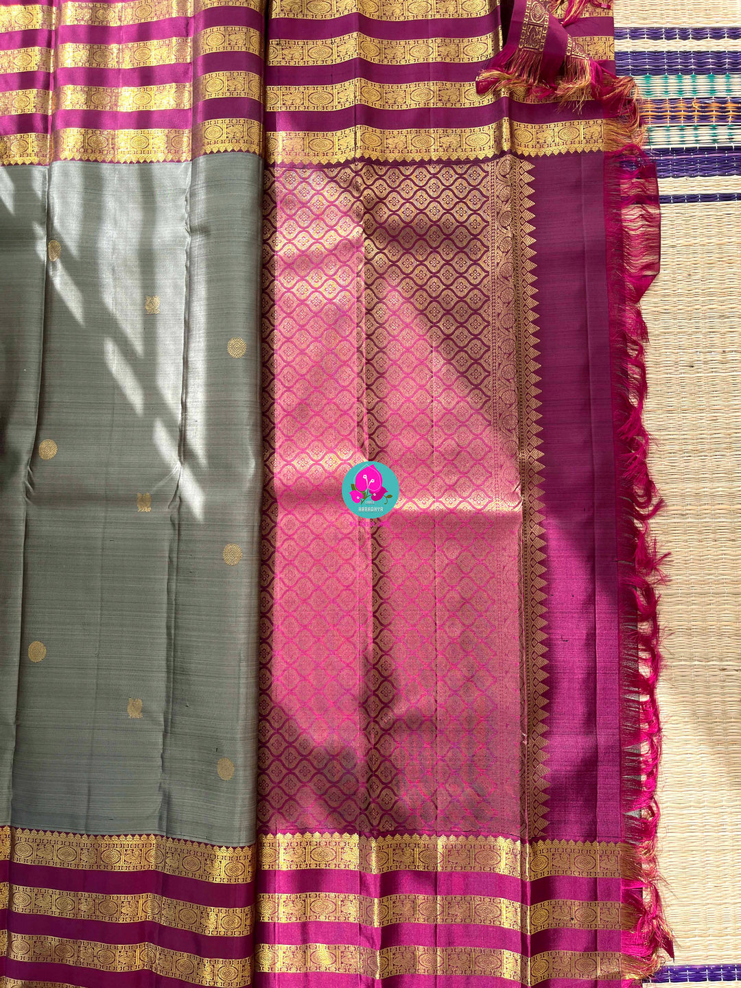 Pure Kanchipattu treasure in Elaichi greenish grey color paired with hand embroidered blouse