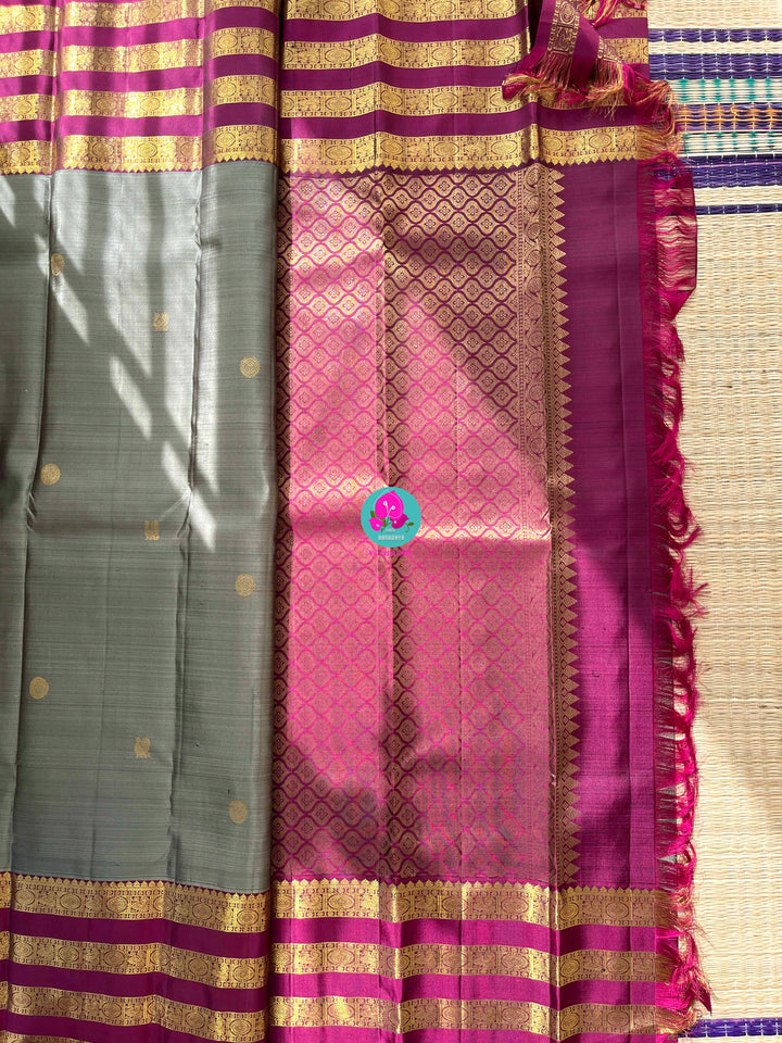 Pure Kanchipattu treasure in Elaichi greenish grey color paired with hand embroidered blouse