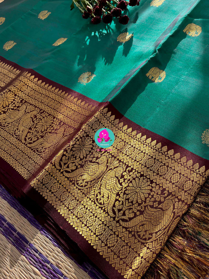 Pure Peacock green Kanchipattu handloom saree with hand embroidered short sleeves blouse