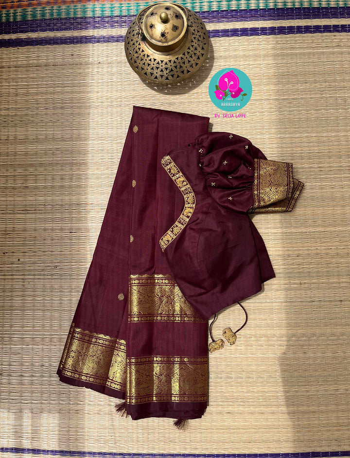 Kanchipuram 2g zari brown vintage saree with Hand embroidered Puff sleeves blouse.