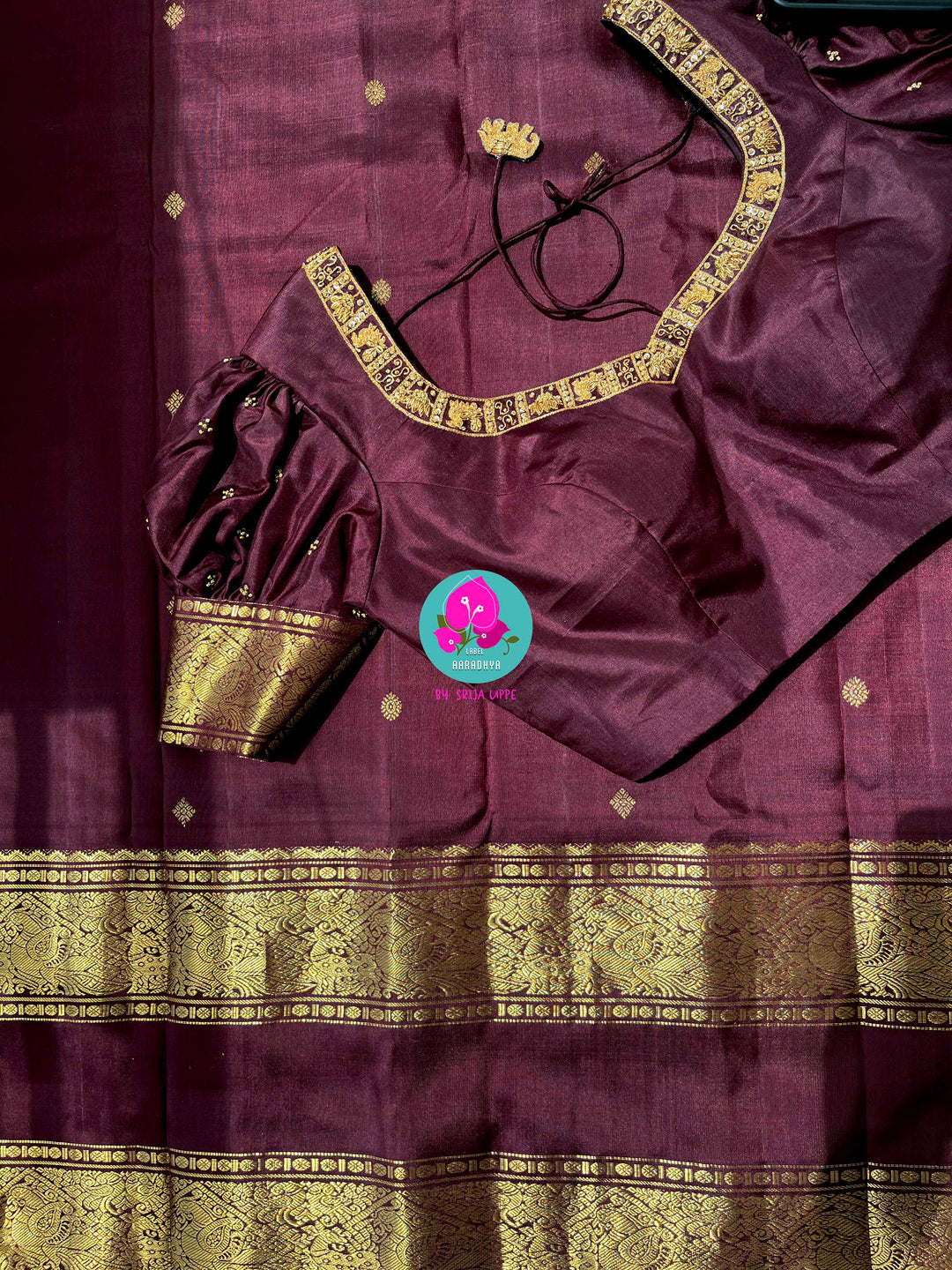 Kanchipuram 2g zari brown vintage saree with Hand embroidered Puff sleeves blouse.
