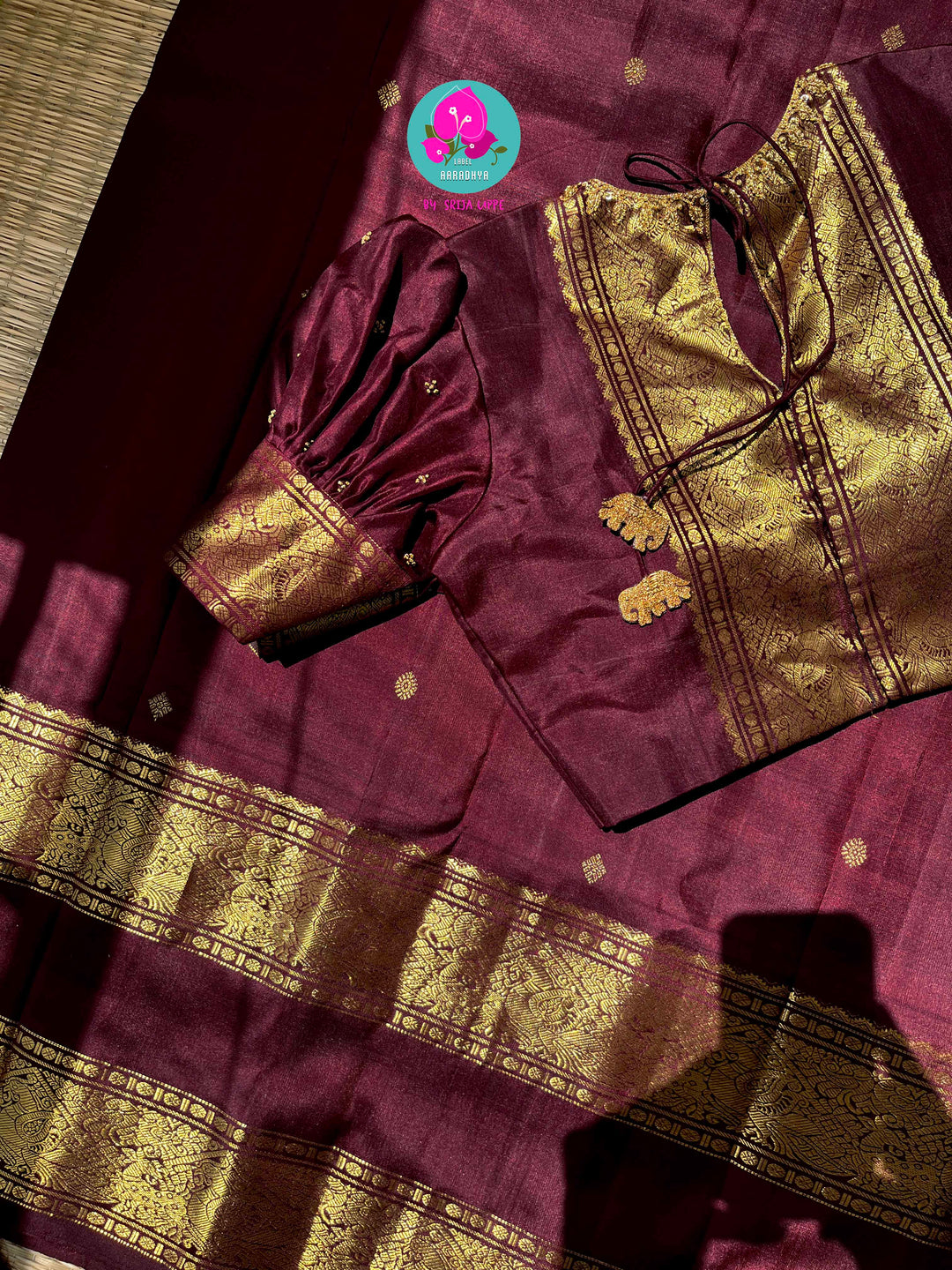 Kanchipuram 2g zari brown vintage saree with Hand embroidered Puff sleeves blouse.