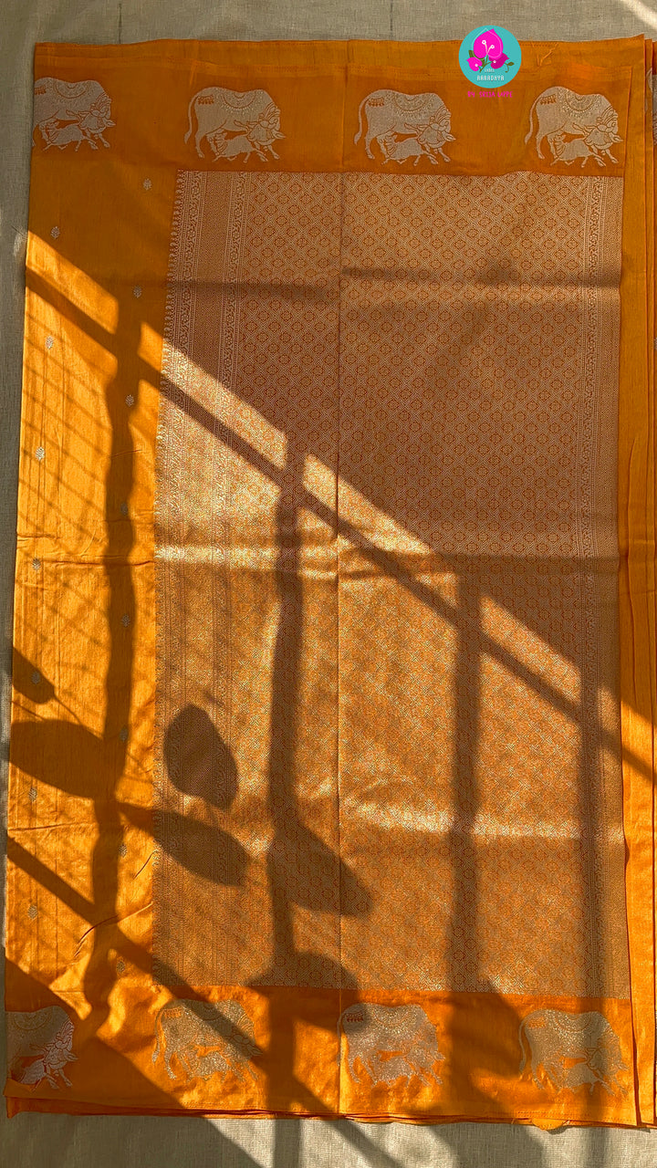 Benarasi semi raw mango silk saree with Khamdhenu weave in Tangerine color