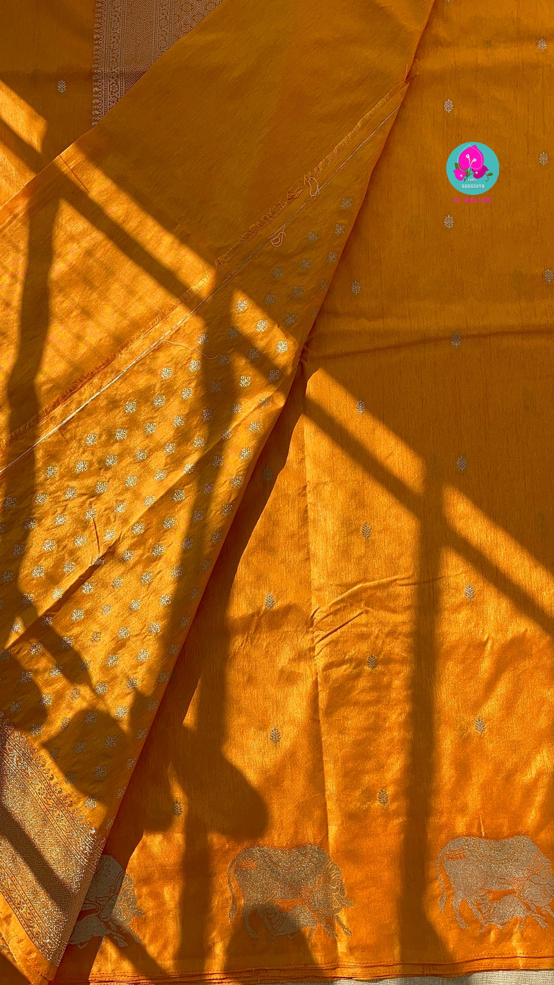 Benarasi semi raw mango silk saree with Khamdhenu weave in Tangerine color