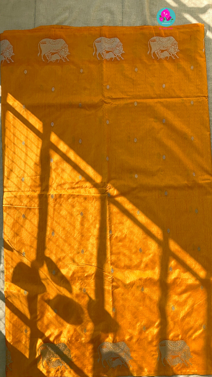 Benarasi semi raw mango silk saree with Khamdhenu weave in Tangerine color